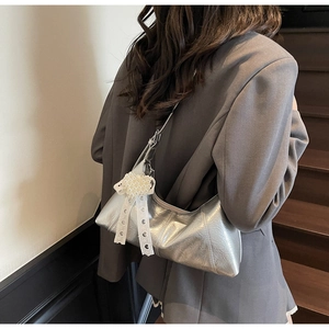 Silver wrinkled patent leather hobo bag with pearl heart and lace bow detail