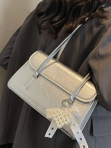 Silver wrinkled leather underarm bag with pearl heart charm and lace ribbon detail