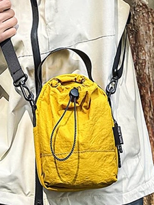 Yellow drawstring bucket bag made of waterproof nylon for outdoor hiking and cycling
