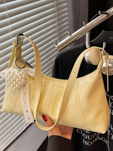 Fashionable pale yellow underarm bag with lace bow and pearl heart charm for women