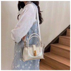 Detailed shot of white PVC jelly tote bag with inner pouch shown on a model