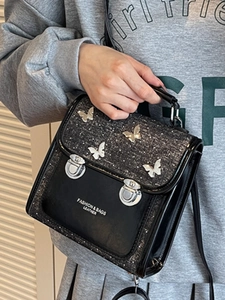 Retro black butterfly handbag for women featuring silver hardware and a trendy crossbody strap