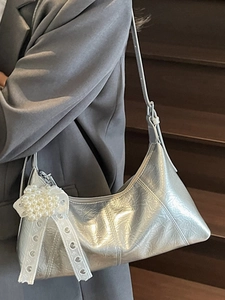 Silver metallic crinkled half-moon underarm bag with pearl heart charm and lace ribbon
