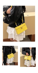 Detailed view of yellow crocodile embossed leather mini crossbody bag with metal zippers