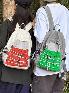 Lightweight waterproof outdoor backpacks in beige-red and grey-green for hiking and travel