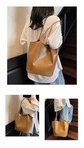 Detail showing high-quality crocodile pattern texture on this large brown tote bag