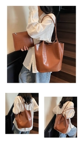 Brown faux leather bucket bag set with crocodile texture and matching clutch on wooden stairs