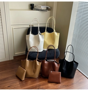 Close-up of crocodile pattern tote bag set with matching pouch in five elegant colors