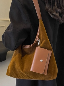 Brown suede hobo tote bag with a small detachable pouch in a stylish casual commuter style