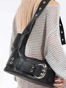 Vintage Y2K punk style black shoulder bag with large silver buckles and metal eyelets
