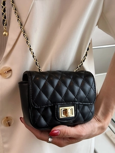 Classic black quilted crossbody bag with gold chain strap and twist-lock closure