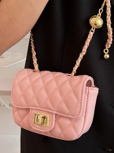 Pink quilted leather crossbody bag with iconic gold ball chain and diamond stitching pattern