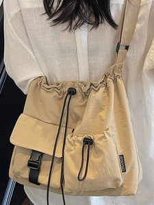 Large capacity khaki nylon drawstring shoulder bag for travel with stylish utility pockets