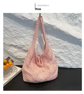 Detail of pink bohemian woven shoulder bag with intricate hollow V-shaped wave pattern