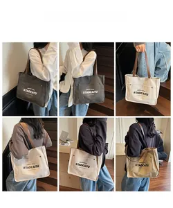 Detail view of large canvas tote bag showing side pockets and various color options