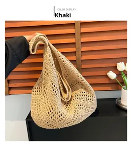 Close-up of khaki crochet shoulder bag with intricate hollow woven patterns and texture