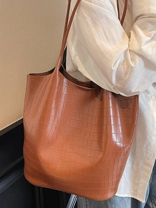 Minimalist large brown crocodile pattern tote bag for women showing crossbody shoulder fit