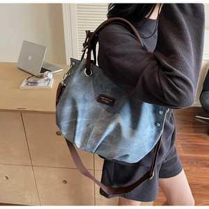 Blue marble texture tote bag with leather handles shown in an office lifestyle setting