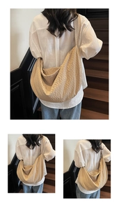 Detail of a large khaki checkered crescent tote bag with a wide shoulder strap