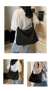 Detail view of large capacity black nylon shoulder bag with minimalist casual design