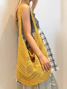 Large yellow bohemian crochet hobo bag with hollow diamond pattern and metal ring detail