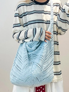Light blue hollow crochet hobo shoulder bag with bohemian woven wave pattern for women