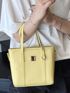 Chic yellow lychee grain leather mini tote bag with golden metal buckle and top handle