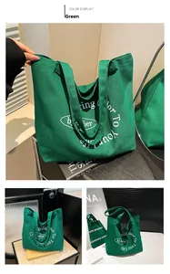 Close-up of green canvas tote bag featuring white Bring Color To Your Life text print