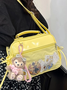 Transparent yellow PVC crossbody ita bag with anime badges and cute plush bear charm