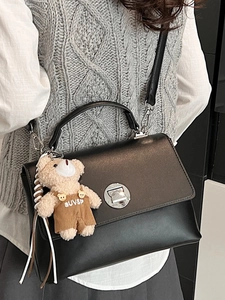 Classic black PU leather flap handbag with metal lock and cute teddy bear charm detail