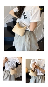 Litchi texture beige bucket bag with adjustable strap and S.Y.S. logo detail