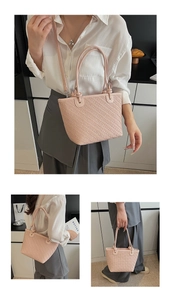 Detailed close-up of pink woven texture tote bag with detachable shoulder strap