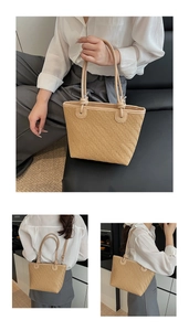 Detailed view of the woven straw tote bag featuring herringbone pattern and knotted handle