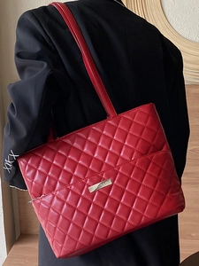 Red quilted leather large tote bag with elegant diamond pattern and silver brand logo