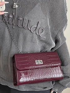 Classic burgundy crocodile pattern crossbody bag with silver chain strap and metal lock