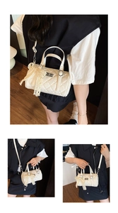 Detail of white quilted crossbody bag with lace bow and adjustable silver hardware