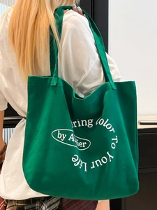 Green canvas tote bag with Bring Color To Your Life slogan and comfortable shoulder straps