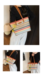 Macro view of woven rainbow tote bag featuring brown leather handles and sunflower charm