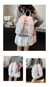 Three views of pink striped bunny ear backpack with star patch and cherry logo detail