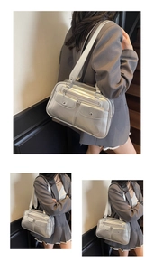 Close-up of metallic silver bowling bag with dual front pockets and glossy texture