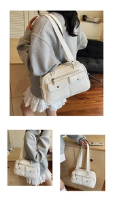 Detail view of cream white PU leather bowling bag with functional double flap pockets