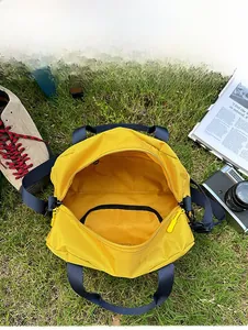 Interior view of yellow nylon crossbody bag showing spacious main pocket and inner zipper
