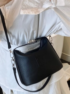 Chic black lychee grain leather crossbody bag with metal clasp for women in daily style
