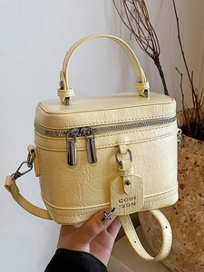 Pale yellow contrast color tote bag with crocodile texture and double zippers