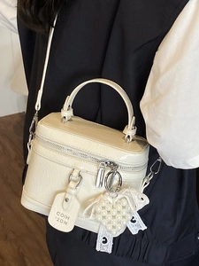 Fashionable cream high-gloss leather crossbody bag with heart pearl charm and top handle