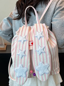 Pink and white striped backpack with cute long bunny ears and plush star decorations