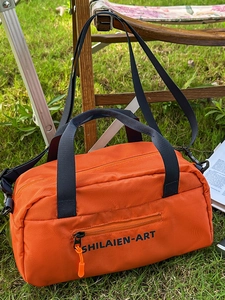 Orange nylon crossbody sports bag for women with blue straps and outdoor casual design