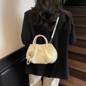 French style pleated cloud shoulder bag in soft cream leather with pearl bow charm
