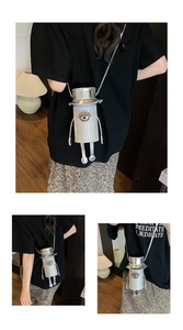 Detail of silver novelty doll-shaped crossbody bag with sequin texture and large eye accents