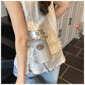 Silver doll-shaped crossbody bag with rhinestone eyes and creative top hat design